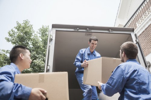 Final boxes being unloaded into a new home in Bow