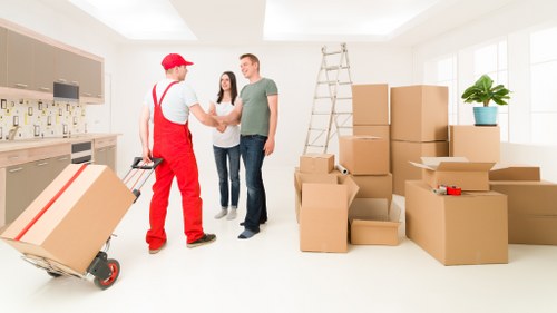 Packed boxes and furniture ready for short-term storage in Bow
