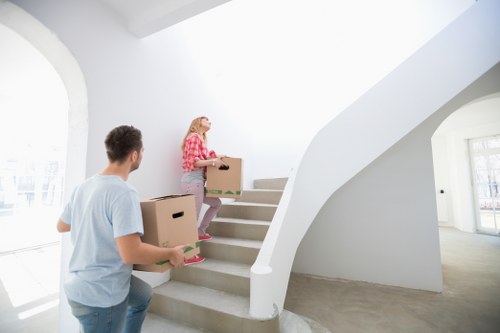Professional movers handling furniture during a Bow relocation