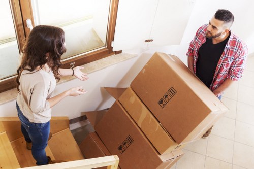 Professional movers handling a small flat relocation in Bow